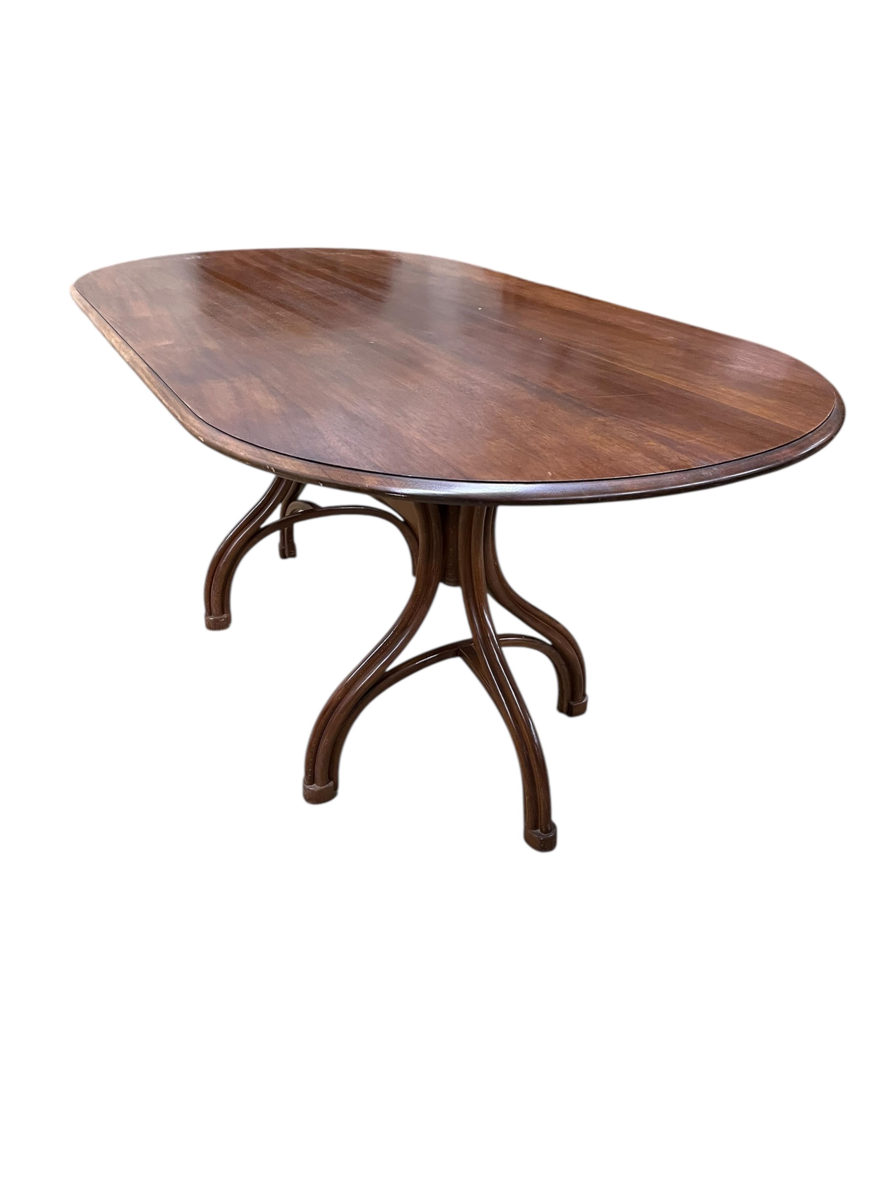 A Dinette caned beech and mahogany bentwood dining suite, comprising: dining table, width 180cm, depth 90cm, height 76cm and six elbow chairs